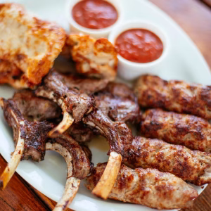 Juicy bone-in lamb chops and seasoned kofta, grilled to perfection and served with two tangy tomato dipping sauces.