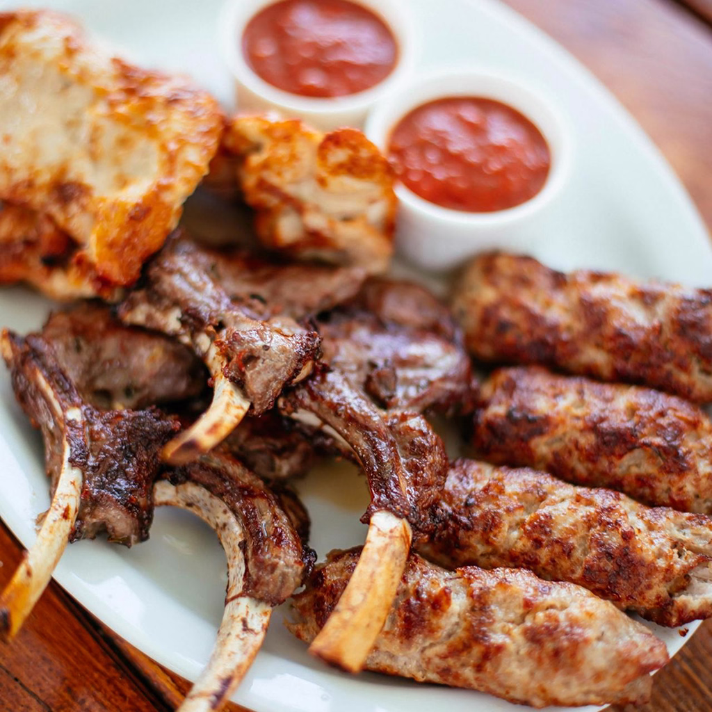 Juicy bone-in lamb chops and seasoned kofta, grilled to perfection and served with two tangy tomato dipping sauces.